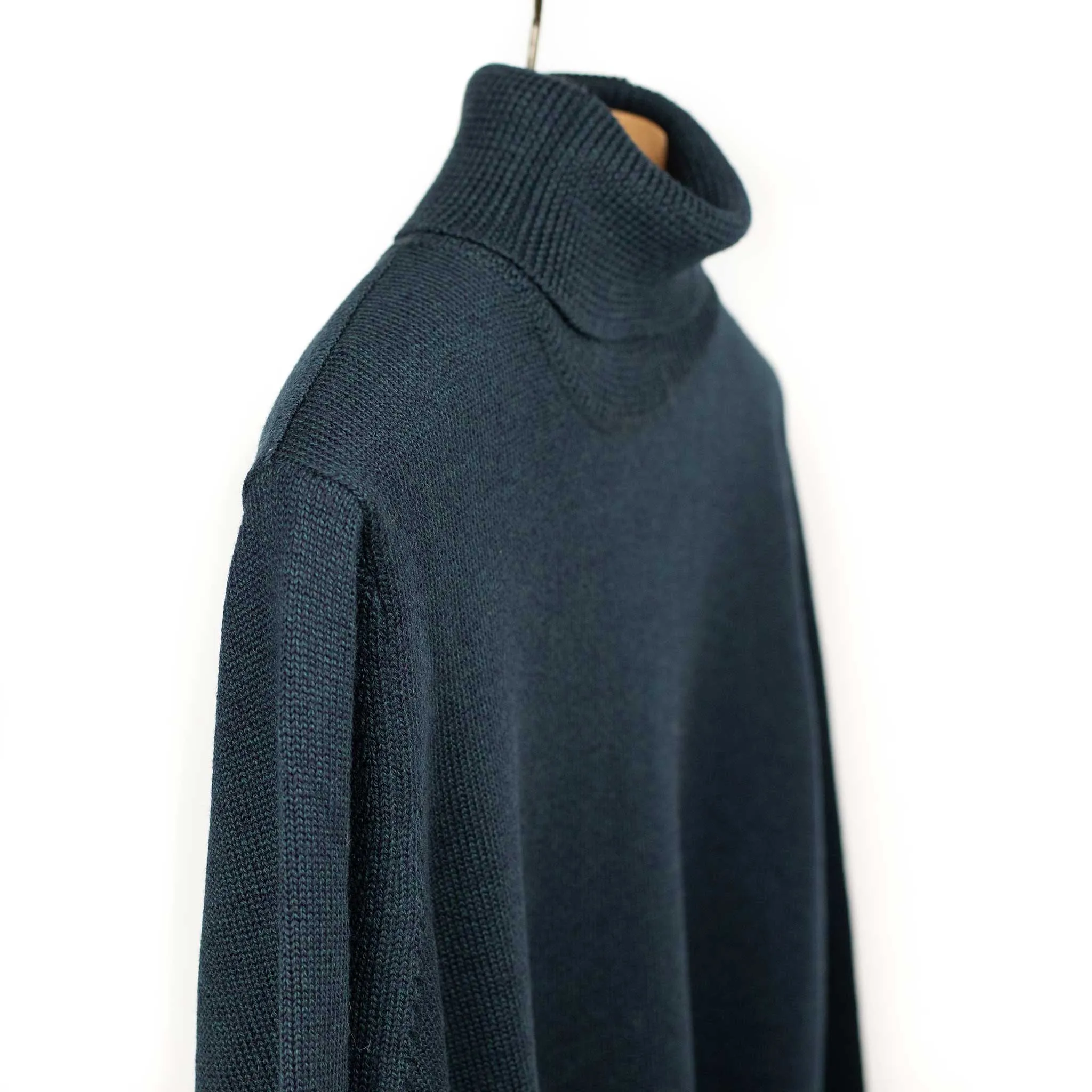 Rollneck sweater in petrol superfine merino wool